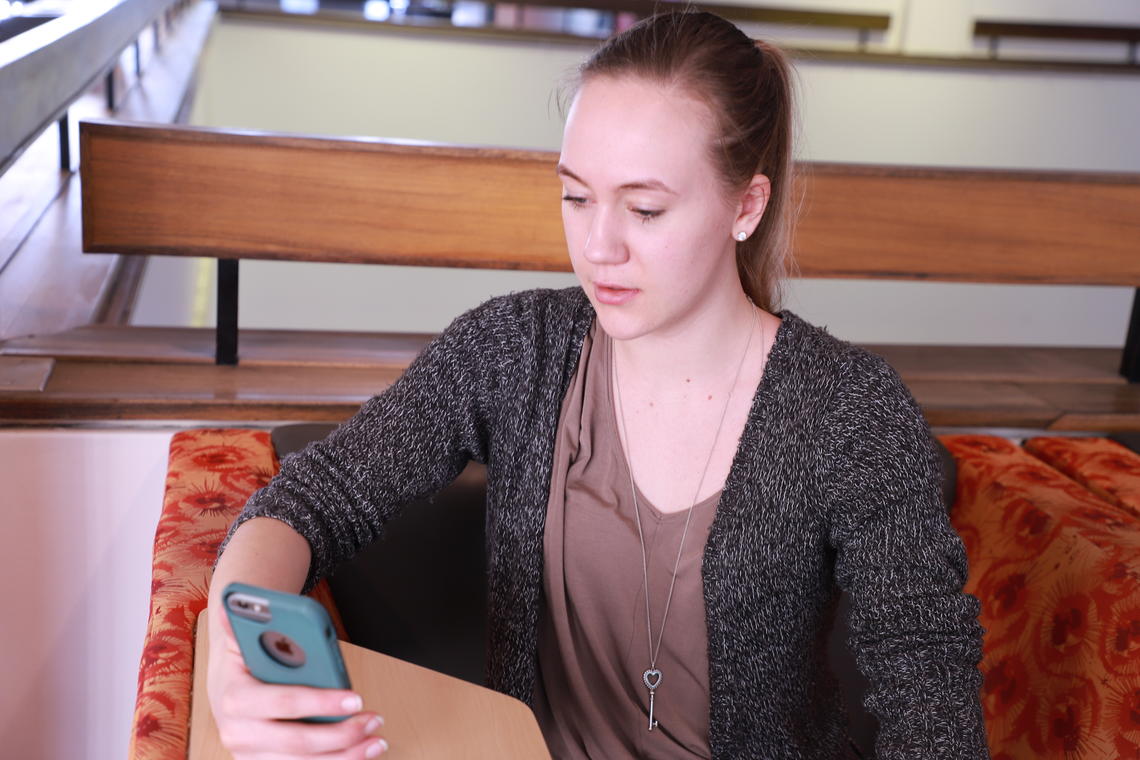 Third-year student Kiley Carson checks out UCalgary’s redesigned online student centre.