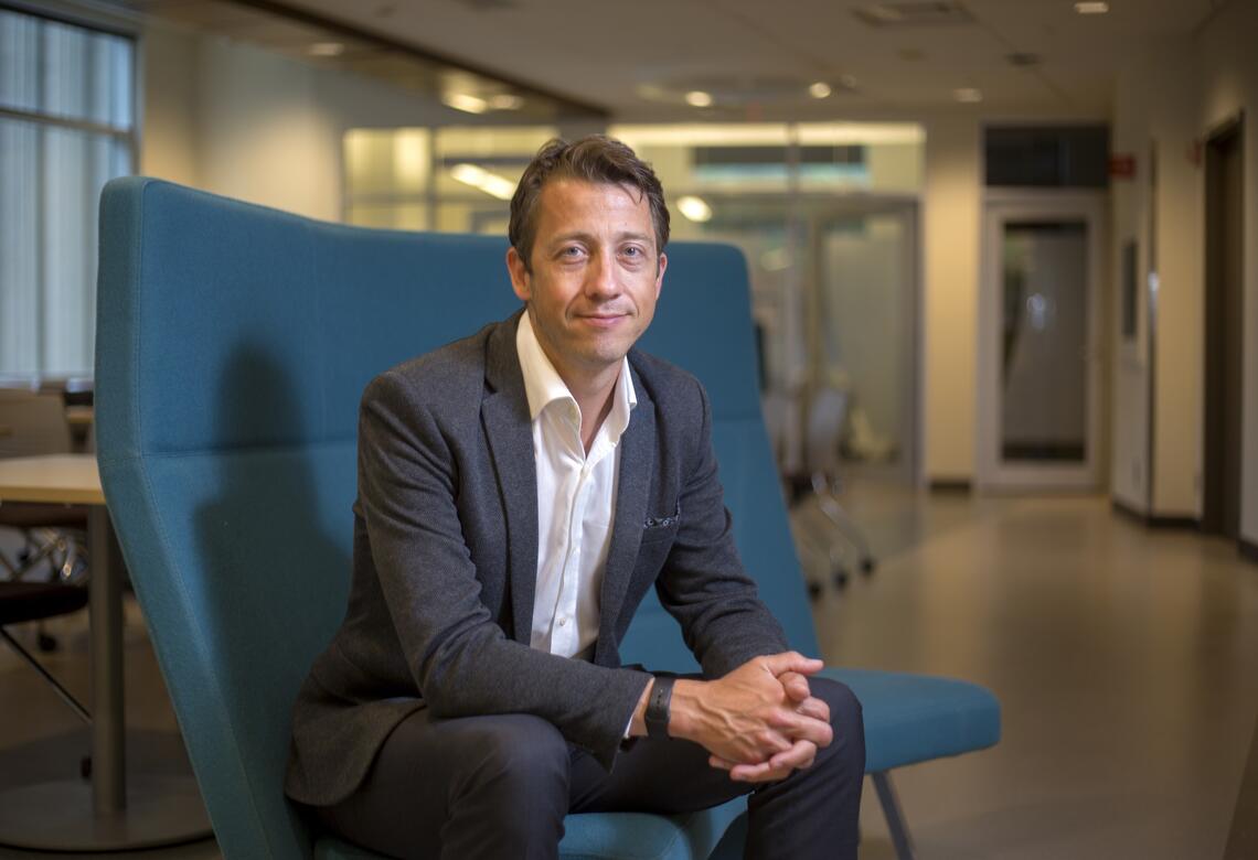 Dr. Shane Sinclair sitting at the Faculty of Nursing