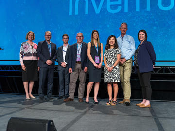 3rd Place - Qualisure Diagnostics. From left: Dr. Brenda Kenny, Dr. Oliver Bathe, Brandon Friedt, Dr. David Bocking, and Dr. Cynthia Stretch, Elisa Park, Ken Moore, and Sandra Stabel.