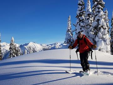 A heli ski guide volunteering.