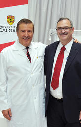 The Cumming School of Medicine is named in honour of Geoffrey Cumming, left, shown with medical school Dean Jon Meddings at the 2014 event announcing the largest donation in the University of Calgary’s history. Photos by Jaekyun Im, for the Cumming School of Medicine