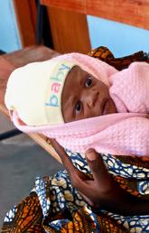 Known locally as Mama na Mtoto (mother and baby in Swahili), UCalgary's Cumming School of Medicine project provides on-the-ground clinical, education and research support to help mothers and babies. Here, a two-day-old baby awaits a checkup at a health facility in Misunwi District, Tanzania. Photo by Ashley Anderson