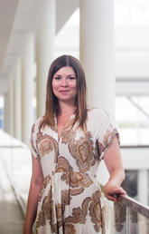 Portrait of woman standing in hallway