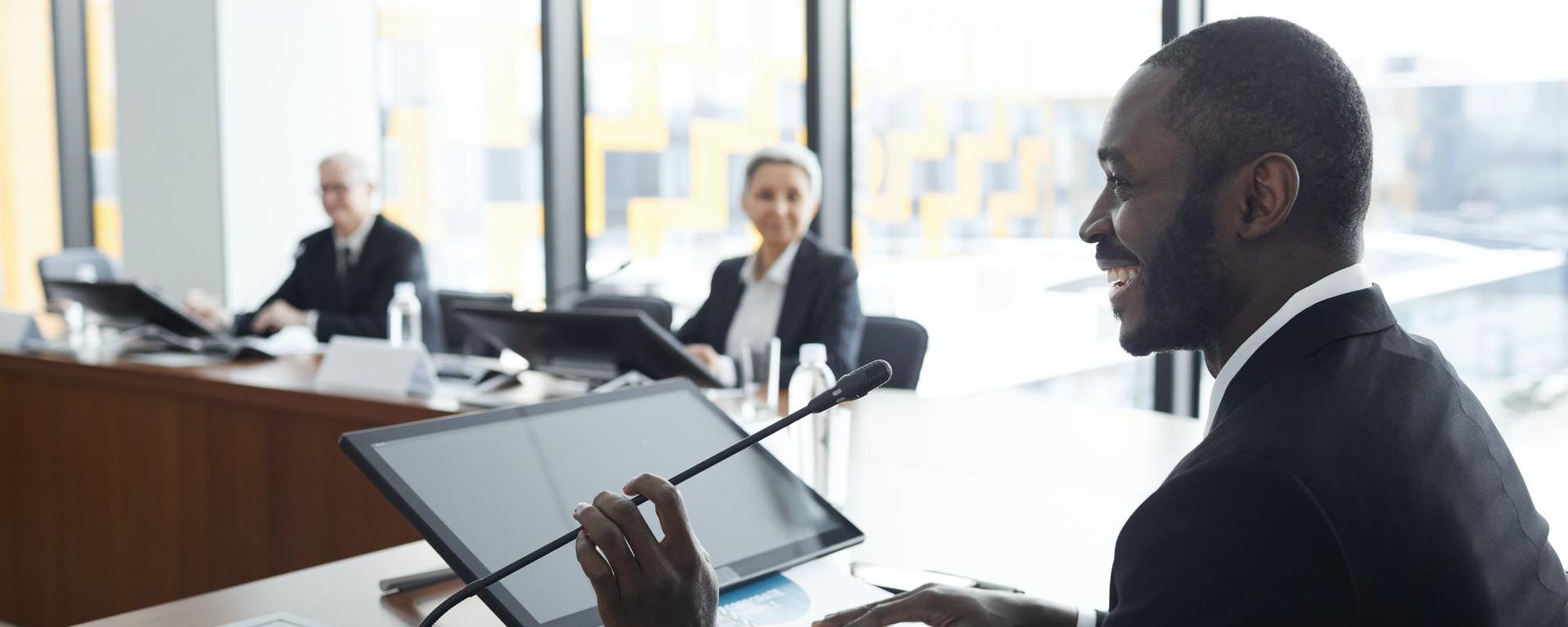 Three people captured during a conference