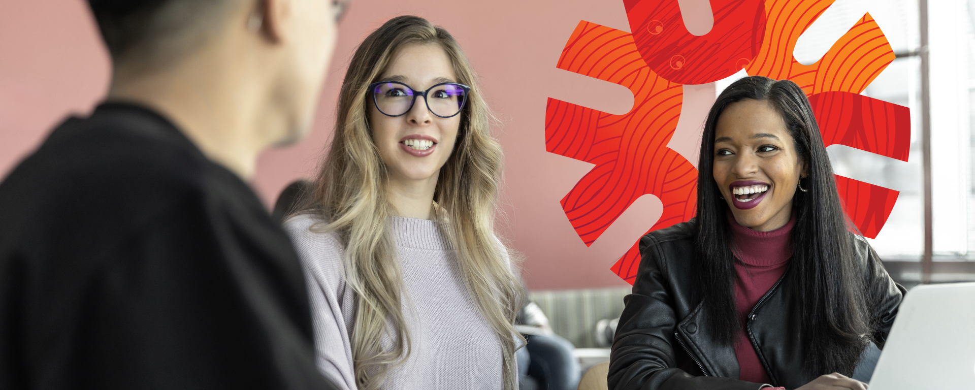 Students talking with textbook on table