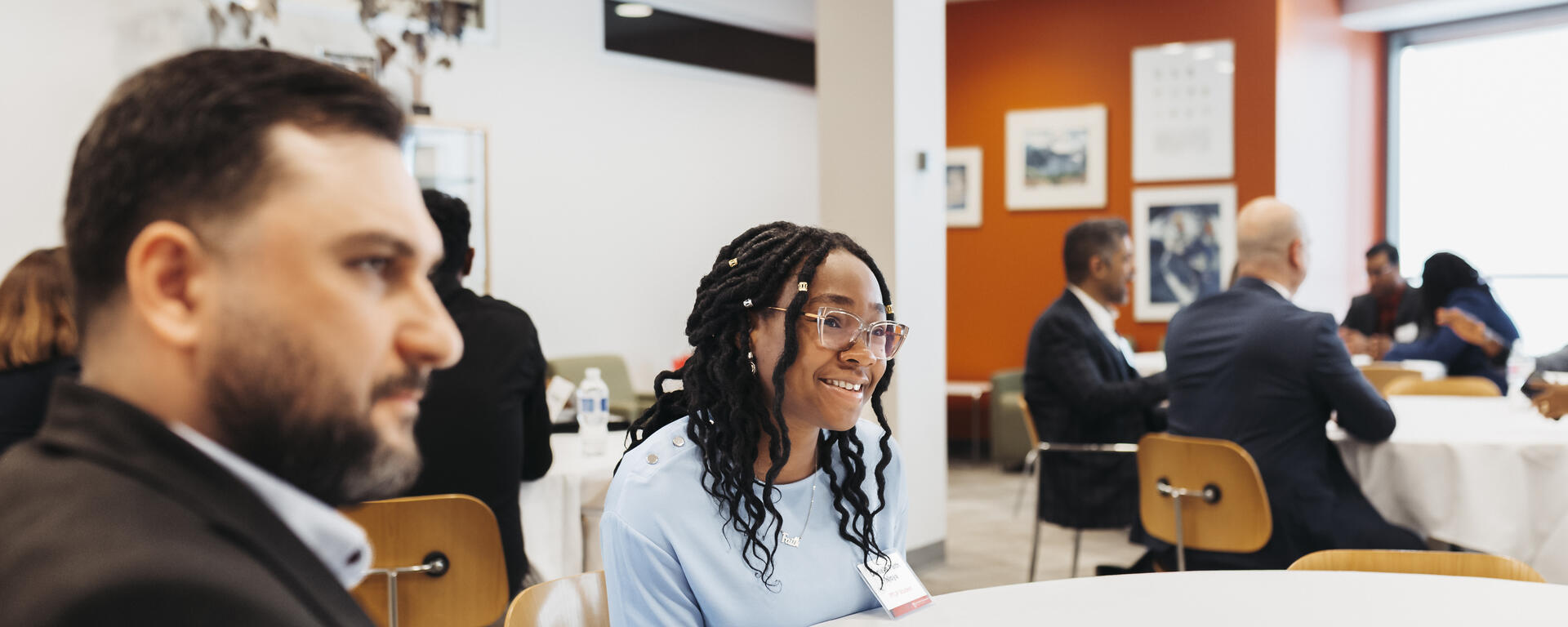 students talking around table
