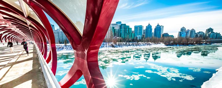 A view to the downtown Calgary skyline from the iconic Peace Bridge over the Bow River