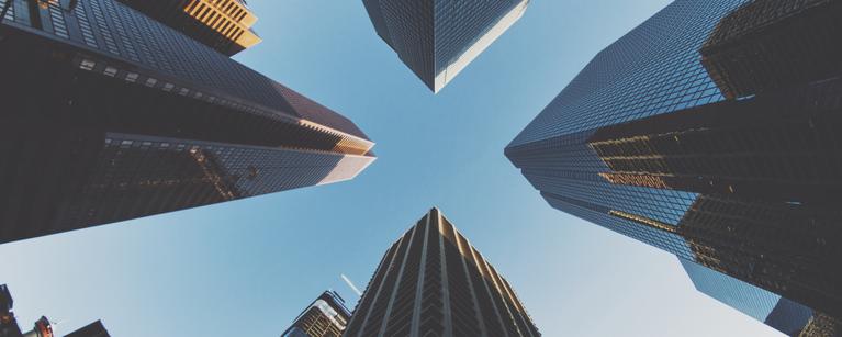 Looking up from the ground at office towers