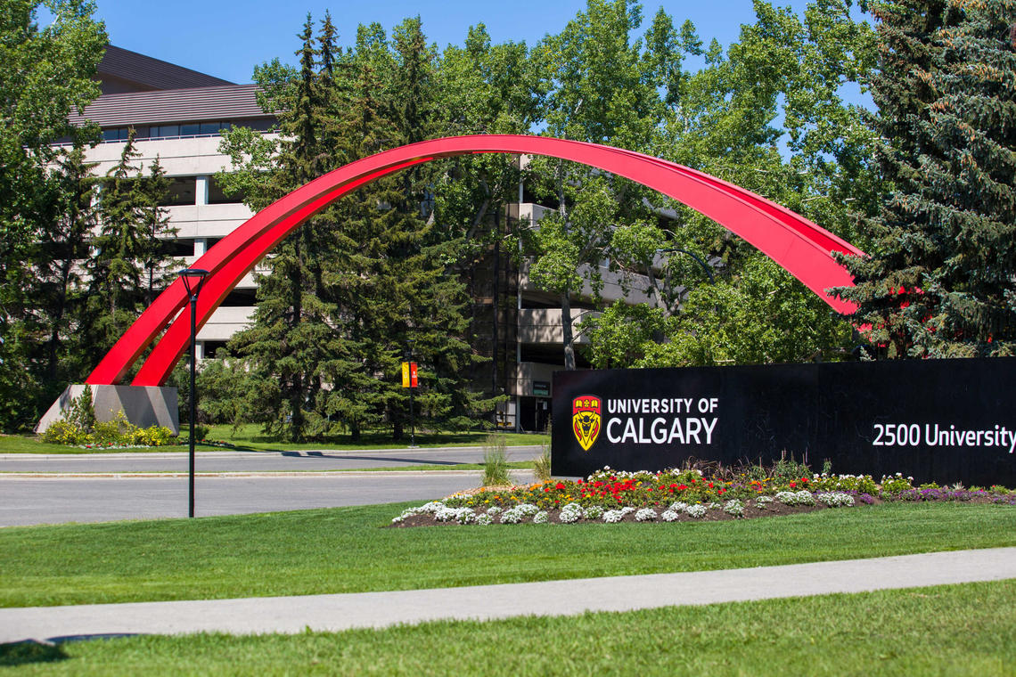 The red archway and welcome sign at the entrance to the University of Calgary