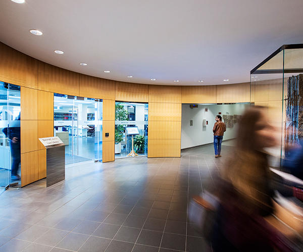 Students moving in the atrium outside of the Bennett Jones Law Library