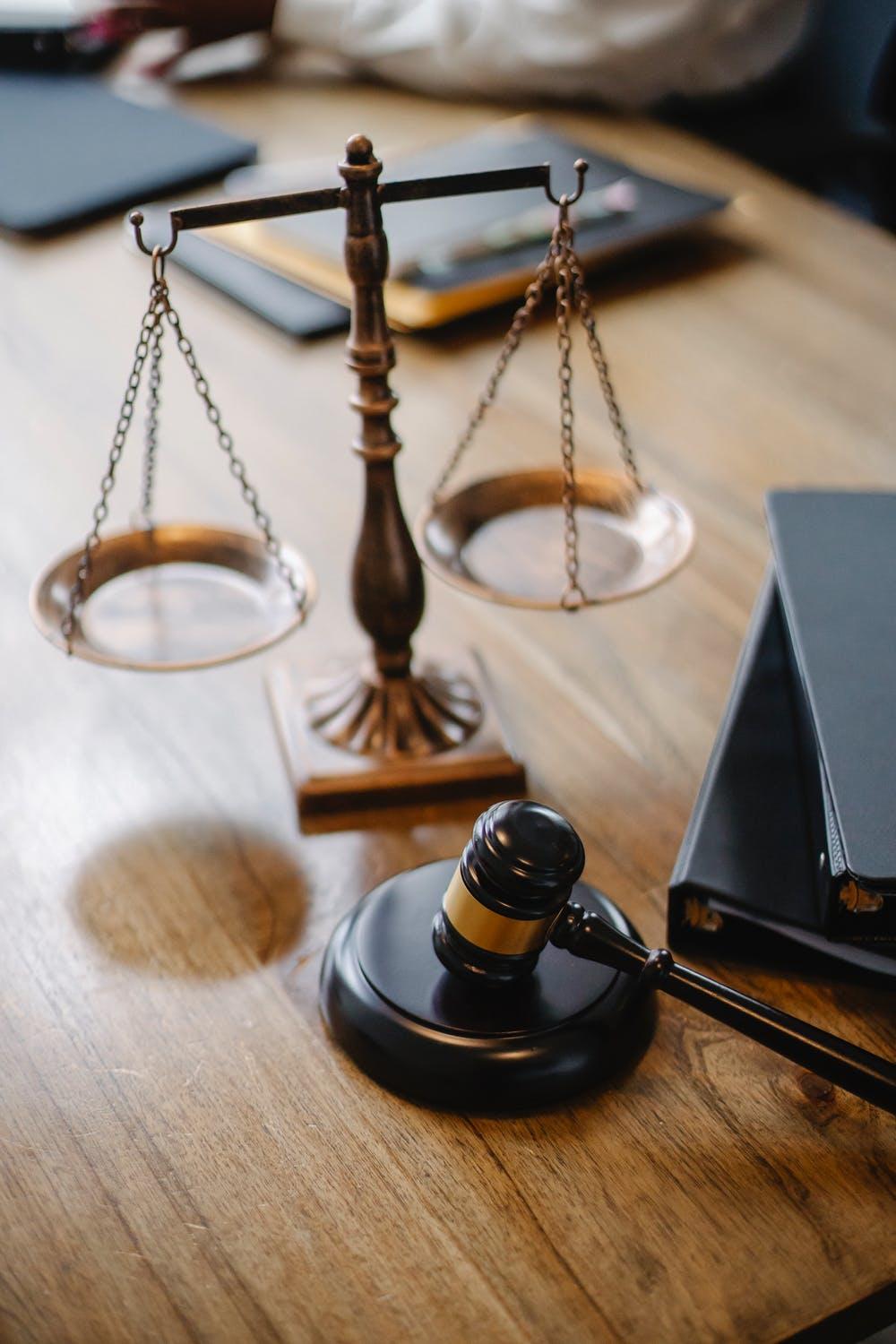 Judges desk with gavel and scales