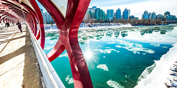 A view to downtown Calgary on a winter day from the iconic Peace Bridge over the Bow River