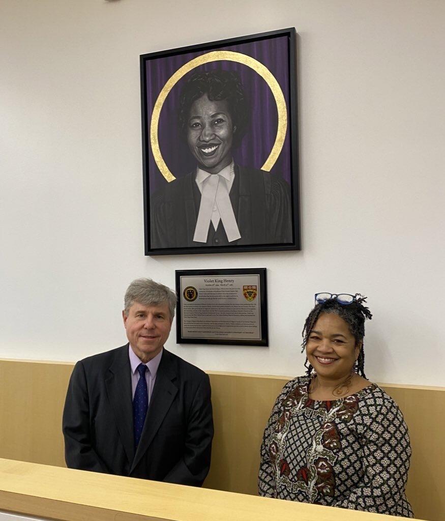 Jo-Anne Henry and UCalgary Law Dean Ian Holloway pose with the new portrait of Violet King Henry.