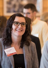 A student engages in conversation at a networking event.