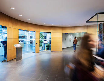 Students moving in the atrium outside of the Bennett Jones Law Library